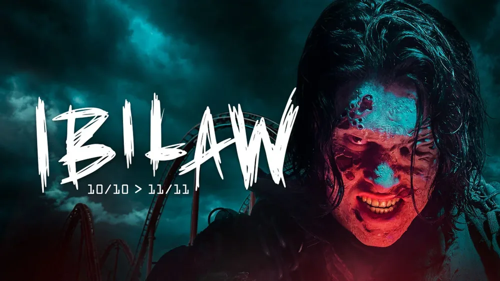 Affiche d'Ibilaw 2026 à Walibi, du 10 octobre au 11 novembre : le titre Ibilaw devant des montagnes russes et un personnage maquillé en zombie